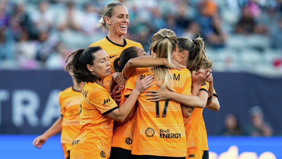 The Houston Dash celebrate their 2-0 win against the San Diego Wave FC on Sunday, Oct. 13, 2024.