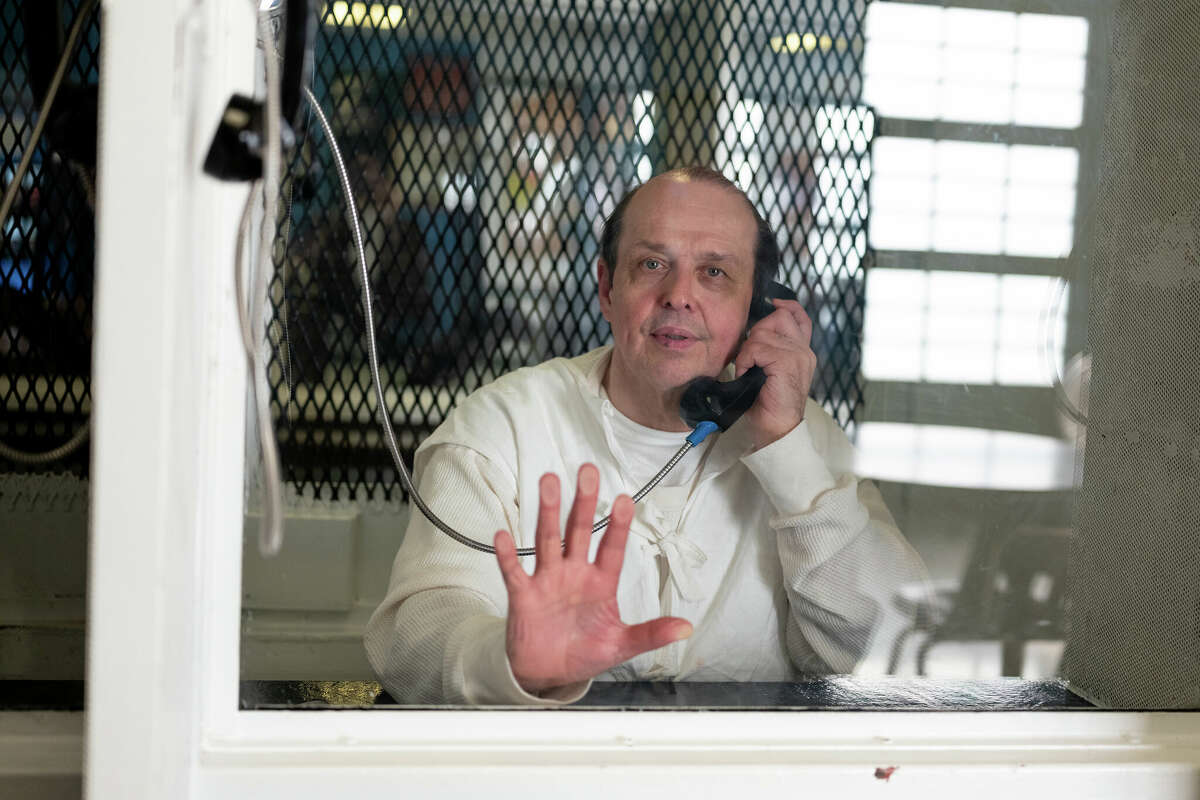 Robert Roberson photographed through plexiglass at TDCJ Polunsky Unit, on Dec. 19, 2023. 