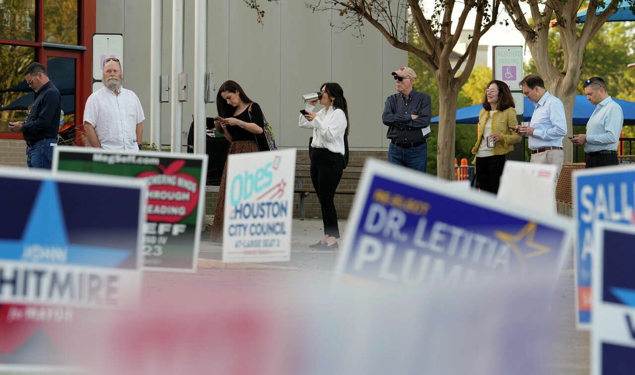 People wait in the line on Nov. 7, 2023, to vote in the general election on Election Day at West Gray Multiservice Center in Houston.