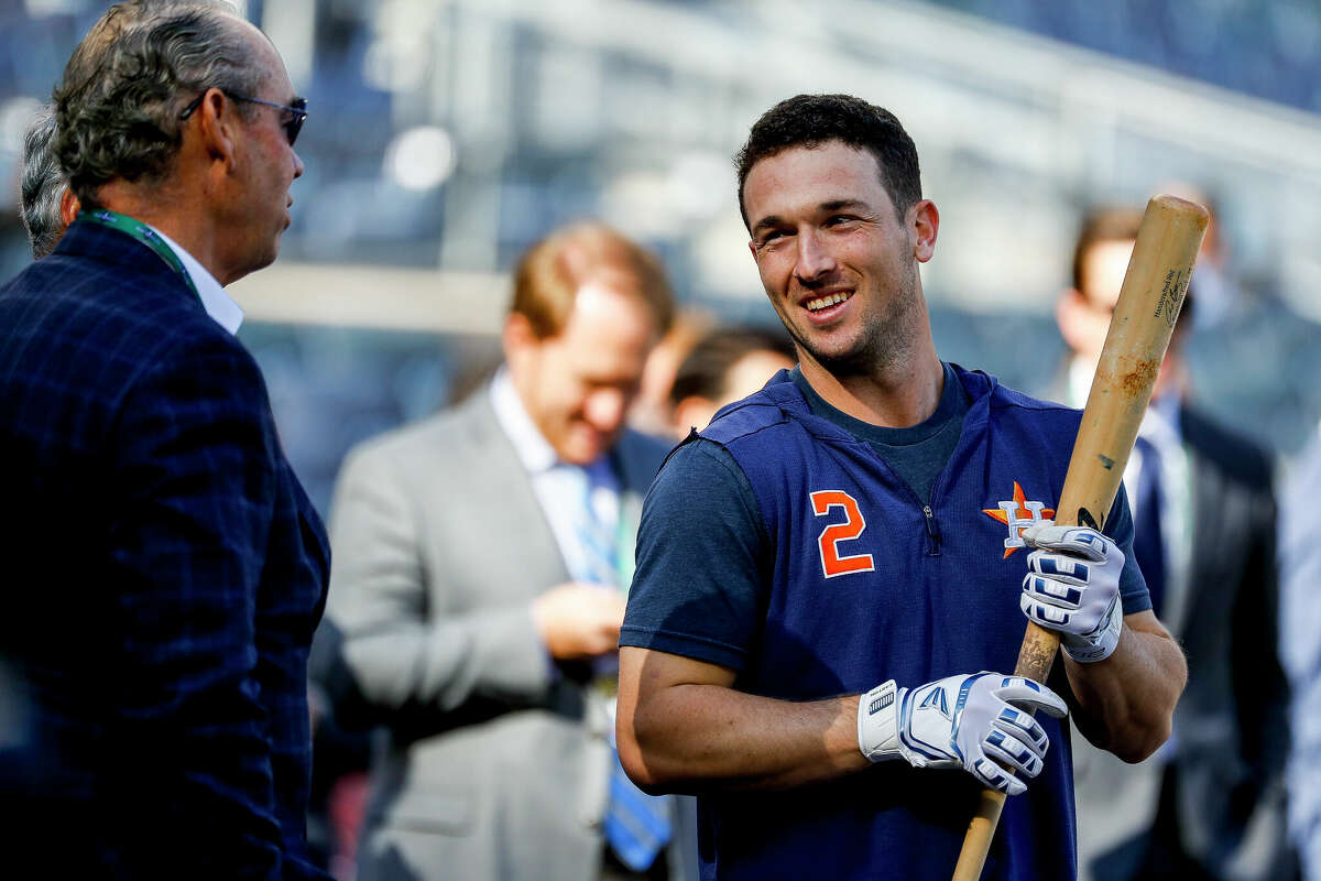 Houston Astros third baseman Alex Bregman (2) talks with Astros owner Jim Crane before Game 3 of the American League Championship Series at Yankee Stadium in New York on Tuesday, Oct. 15, 2019.