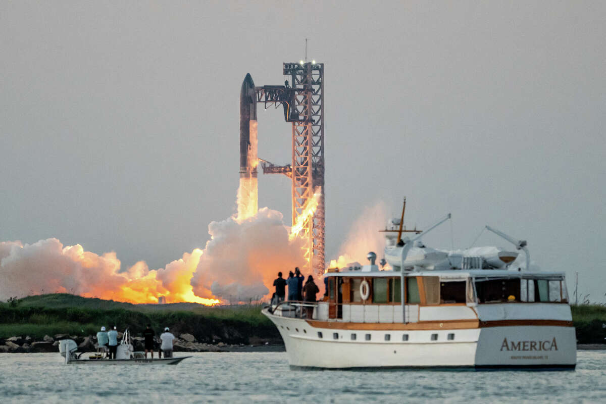 TOPSHOT - The SpaceX Starship lifts off from Starbase near Boca Chica, Texas, on October 13, 2024, for the Starship Flight 5 test. SpaceX successfully 'caught' the first-stage booster of its Starship megarocket Sunday as it returned to the launch pad after a test flight, a world first in the company's quest for rapid reusability. (Photo by SERGIO FLORES / AFP) (Photo by SERGIO FLORES/AFP via Getty Images)