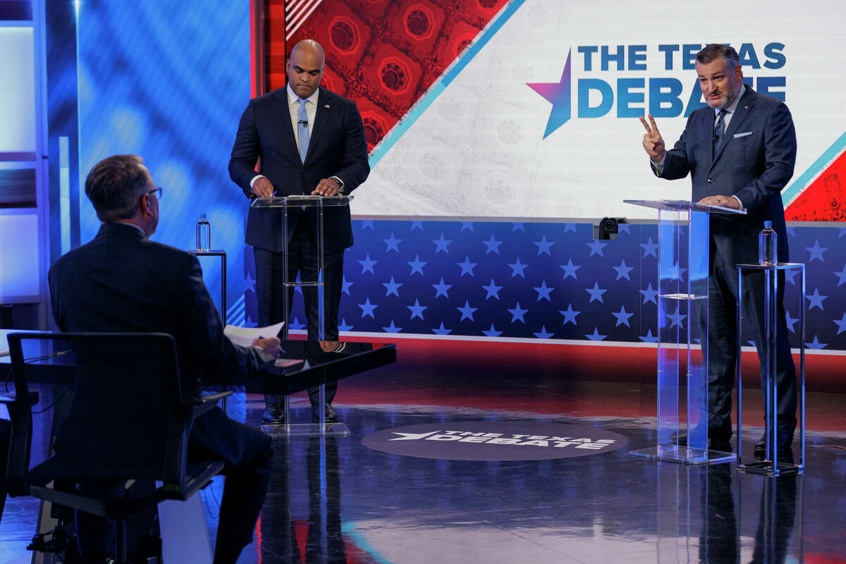 Rep. Colin Allred, D-Texas, top left, takes notes as Sen. Ted Cruz, R-Texas, speaks during a U.S. Senate debate, Tuesday, Oct. 15, 2024, in Dallas. (Shelby Tauber/Texas Tribune via AP, Pool)