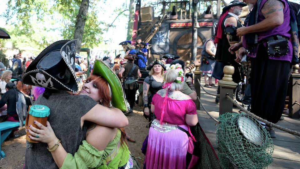 Blowfish hugs long time friend Kirby Summers as he greeted friends in the Sea Devil Tavern during opening day at the 50th Annual Texas Renaissance Festival on Saturday, Oct. 12, 2024, in Todd Mission.