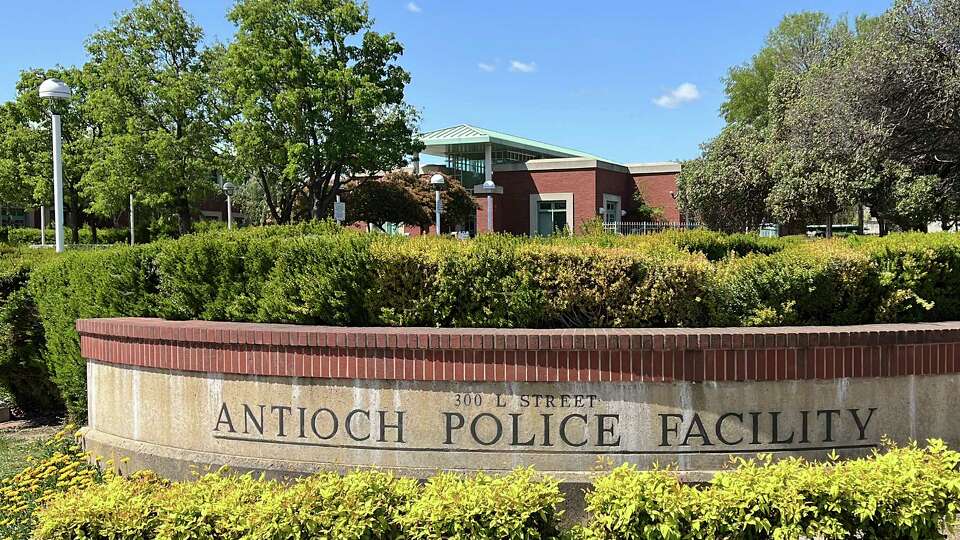 FILE - A sign marks the exterior of the Antioch police headquarters in Antioch, Calif., on April 19, 2023. Racist police text messages containing slurs and images of gorillas will take center stage in a San Francisco Bay Area courtroom on Friday, July 21, 2023, as a judge weighs whether the messages violated a state law designed to stamp out racism in the criminal court system.