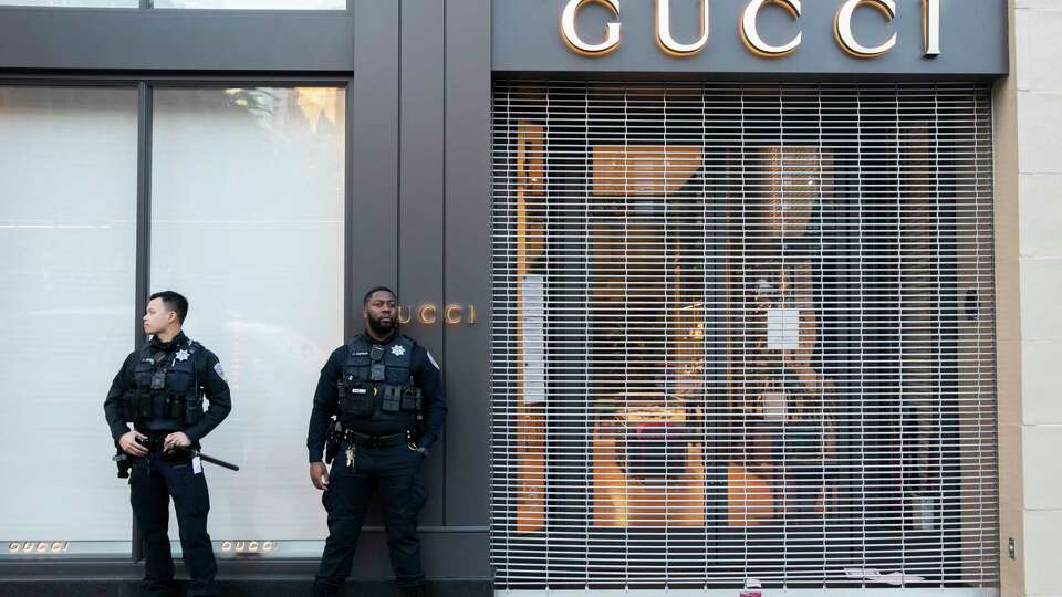 San Francisco Police officers patrol the area as shoppers make their way to stores for Black Friday deals at Union Square in San Francisco, Calif. Friday, Nov. 26, 2021.