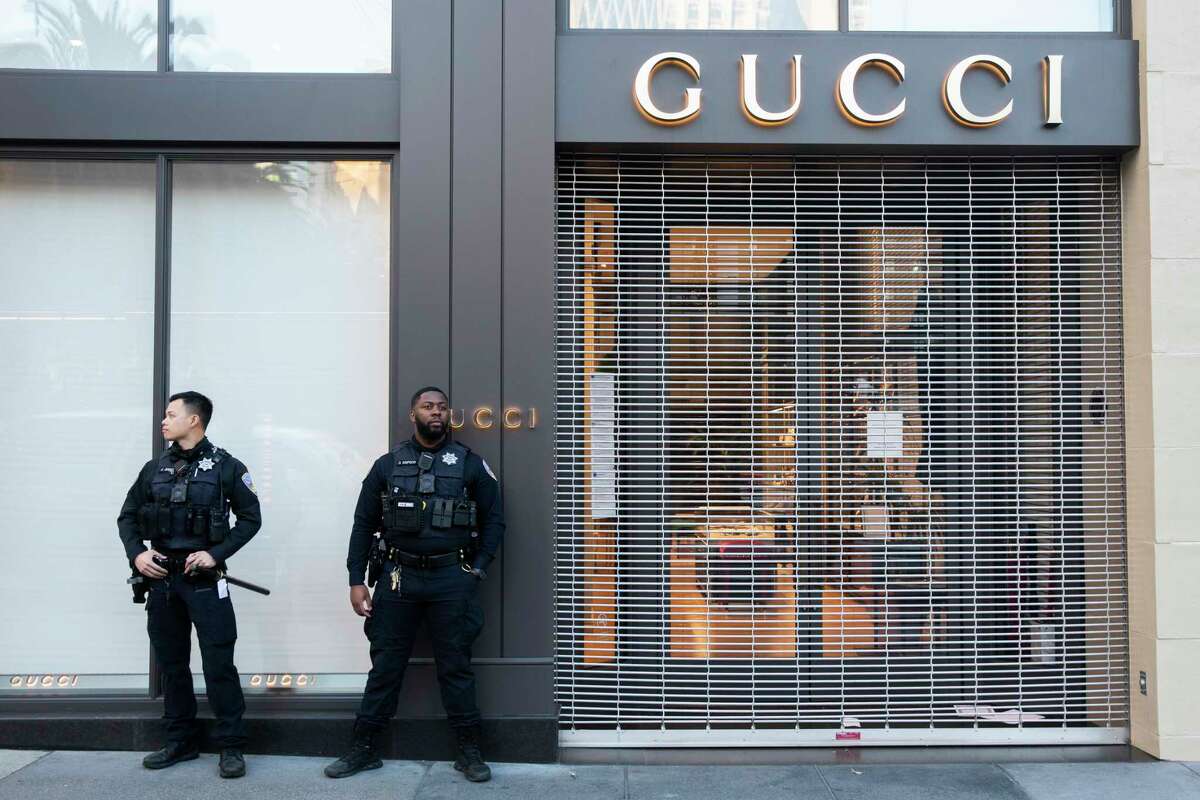 San Francisco Police officers patrol the area as shoppers make their way to stores for Black Friday deals at Union Square in San Francisco, Calif. Friday, Nov. 26, 2021.