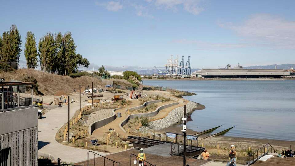 Workers install finishing touches at India Basin Waterfront Park in the India Basin neighborhood of San Francisco, Wednesday, Oct. 16, 2024. The park will open to the public this Saturday.