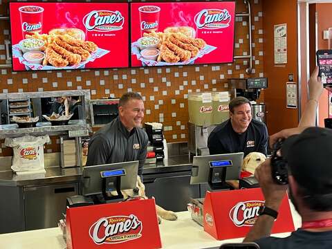 ESPN's Kirk Herbstreit and his dog meet Cane III at Raising Cane's