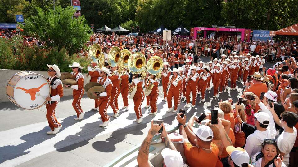 The University of Texas band marches into Darrell K Royal Texas Memorial Stadium before an SEC college football game against Georgia, Saturday, Oct. 19, 2024, in Austin.