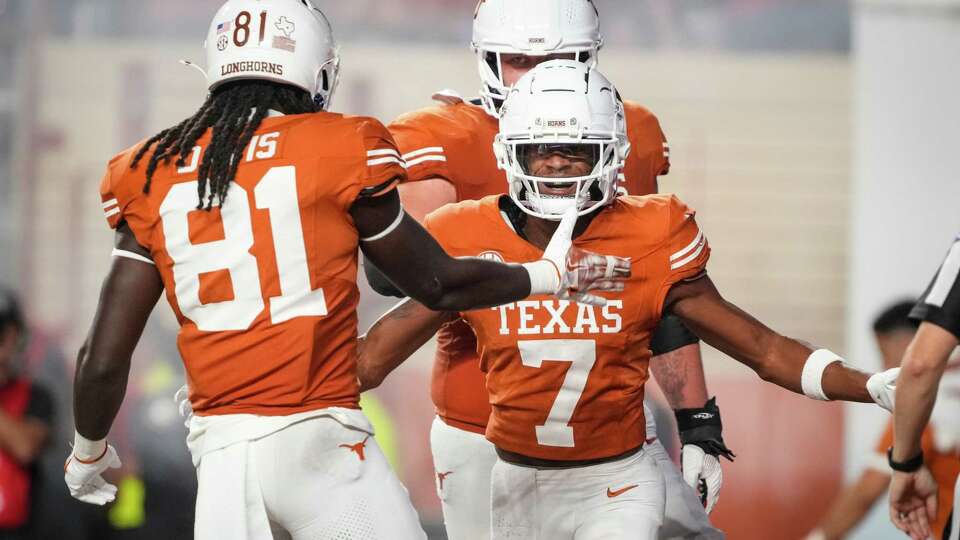 Texas Longhorns wide receiver Isaiah Bond (7) reacts after catching a 2-yard touchdown pass from quarterback Quinn Ewers during the third quarter of a SEC college football game against the Georgia Bulldogs at Darrell K Royal Texas Memorial Stadium, Saturday, Oct. 19, 2024, in Austin.