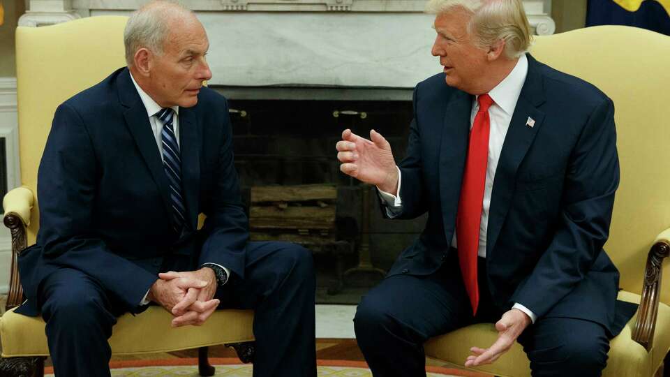 FILE - President Donald Trump talks with White House Chief of Staff John Kelly after he was privately sworn in during a ceremony in the Oval Office in Washington, July 31, 2017.