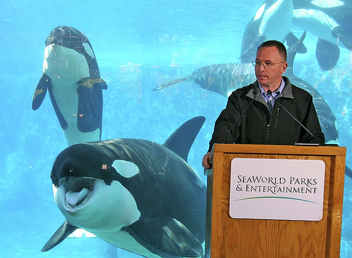 Jim Atchison president & CEO of SeaWorld Parks & Entertainment, speaks during a press conference at the killer whale underwater viewing area of SeaWorld in Orlando, Fla. SeaWorld restarted its killer whale shows three days after Tilikum, the largest orca in captivity, dragged trainer, Dawn Brancheau, to her death on Feb. 24, in the water at the Orlando park.