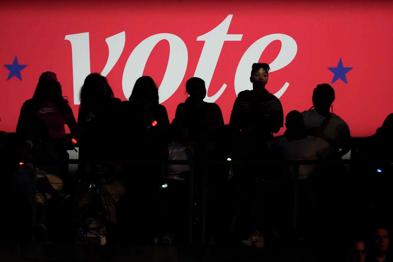 Supporters are photographed before a 