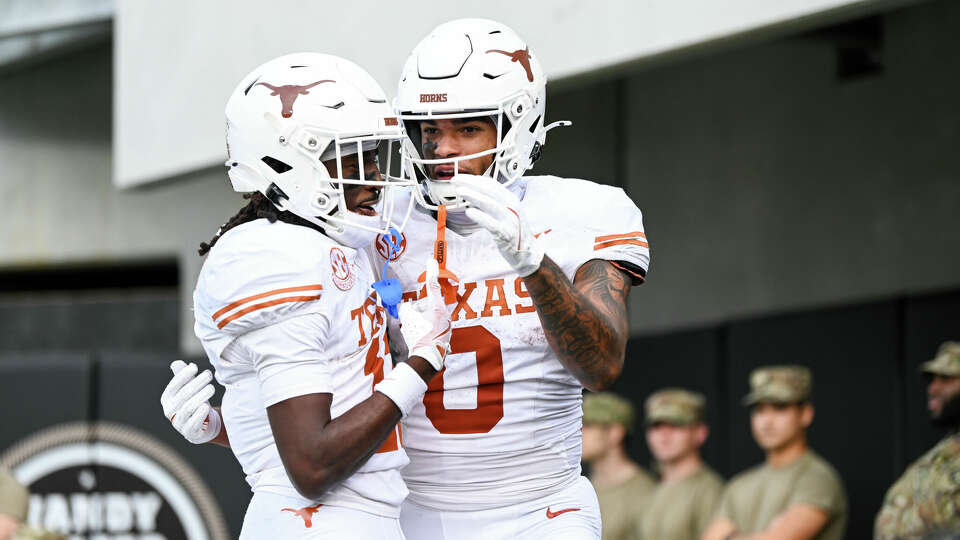 NASHVILLE, TENNESSEE - OCTOBER 26: DeAndre Moore Jr. #0 and Silas Bolden #11 of the Texas Longhorns celebrate a touchdown against the Vanderbilt Commodores in the first half at FirstBank Stadium on October 26, 2024 in Nashville, Tennessee. (Photo by Carly Mackler/Getty Images)