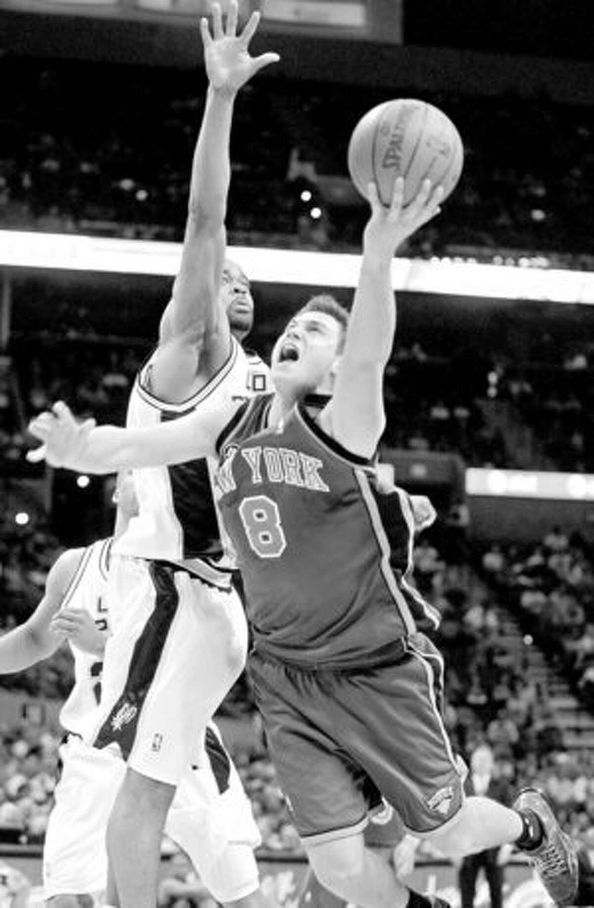 Spurs swingman Malik Hairston defends Knicks forward Danilo Gallinari during the second half.