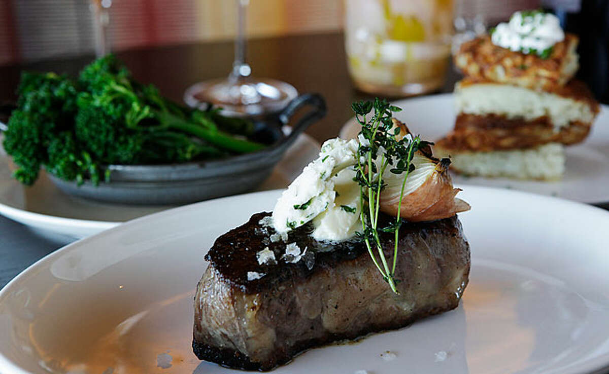 The 12-ounce New York Strip is topped with herbed butter, roasted onion and fresh thyme.