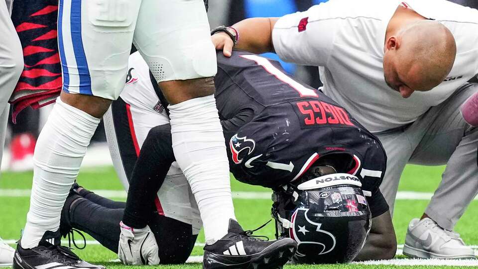 Houston Texans wide receiver Stefon Diggs (1) holds his knee as he goes to the ground with an injury during the second half of an NFL football game against the Indianapolis Colts at NRG Stadium, Sunday, Oct. 27, 2024, in Houston.