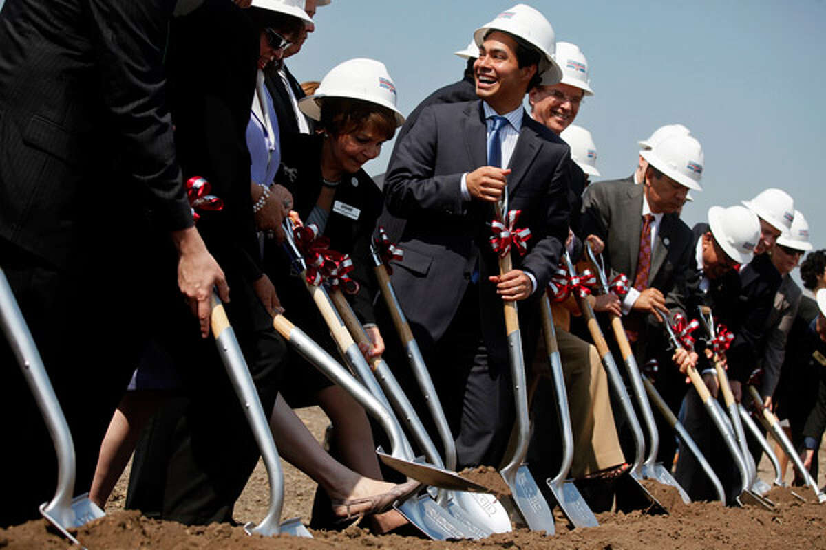 Mayor Juli?n Castro (center) laughs with fellow elected and university officials, including Texas A&M University-San Antonio President Maria Hernandez Ferrier (left), during the groundbreaking.