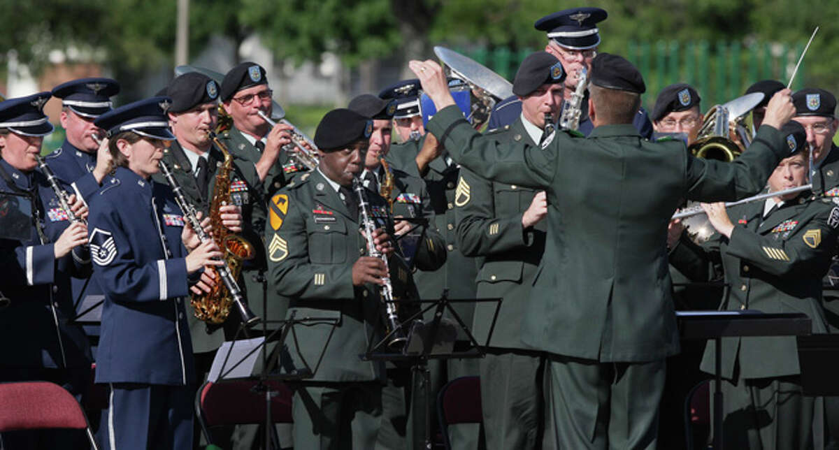 A combined Army-Air Force band plays during a ceremony in which the Army garrison at Fort Sam becomes the 502nd Mission Support Group/Garrison. Its parent, the 502nd Air Base Wing, also oversees logistics at Randolph and Lackland AFBs.