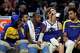 From left, Draymond Green, Jonathan Kuminga, Brandin Podziemski and Trayce Jackson-Davis watch from the bench during the Warriors’ home opener on Oct. 27.
