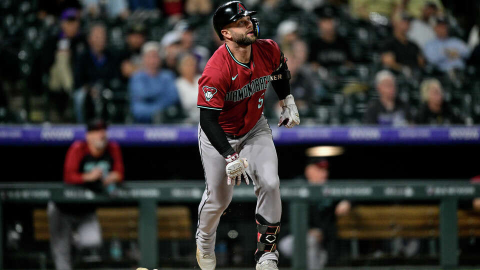 Christian Walker of the Arizona Diamondbacks hits an eighth inning solo home run against the Colorado Rockies at Coors Field on September 17, 2024 in Denver, Colorado.