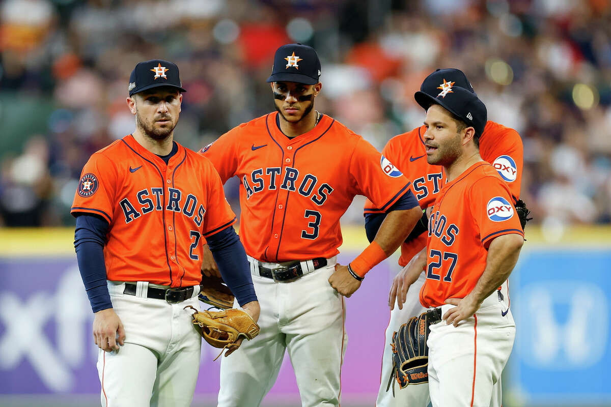 HOUSTON, TEXAS - OCTOBER 02: Alex Bregman #2 of the Houston Astros, Jeremy Pena #3, and Jose Altuve #27 talk during a pitching change in the sixth inning against the Detroit Tigers during Game Two of the Wild Card Series at Minute Maid Park on October 02, 2024 in Houston, Texas. (Photo by Tim Warner/Getty Images)