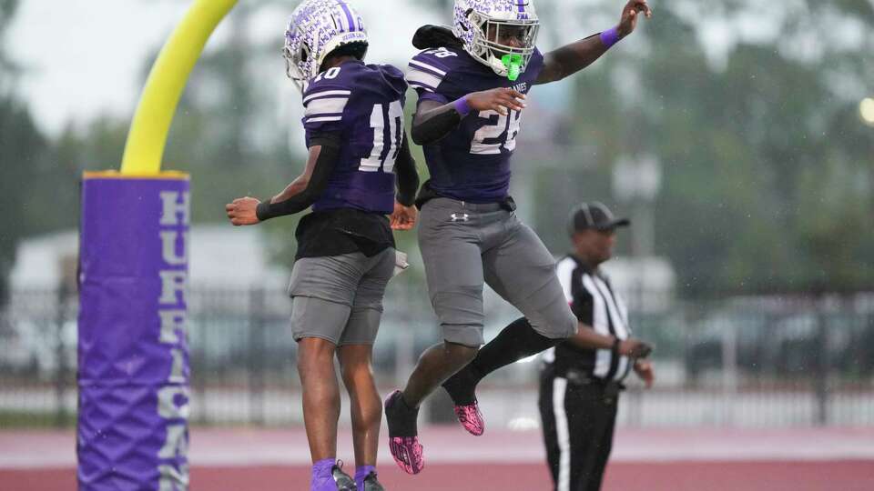 Klein Cain running back Jaelon Dixon, right, celebrates his 3-yard touchdown with wide receiver Babajide Balogun during the second half of a District 15-6A high school football game at Klein Memorial Stadium, Saturday, Nov. 2, 2024, in Spring.