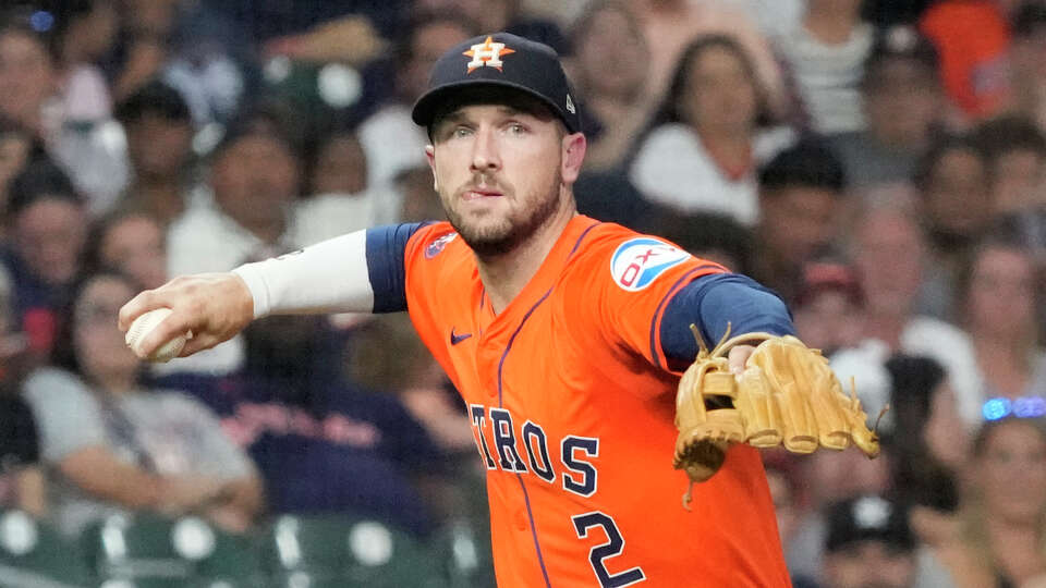 Houston Astros third baseman Alex Bregman (2) makes the throw to first during the seventh inning of an MLB baseball game at Minute Maid Park on Friday, Aug. 2, 2024, in Houston.