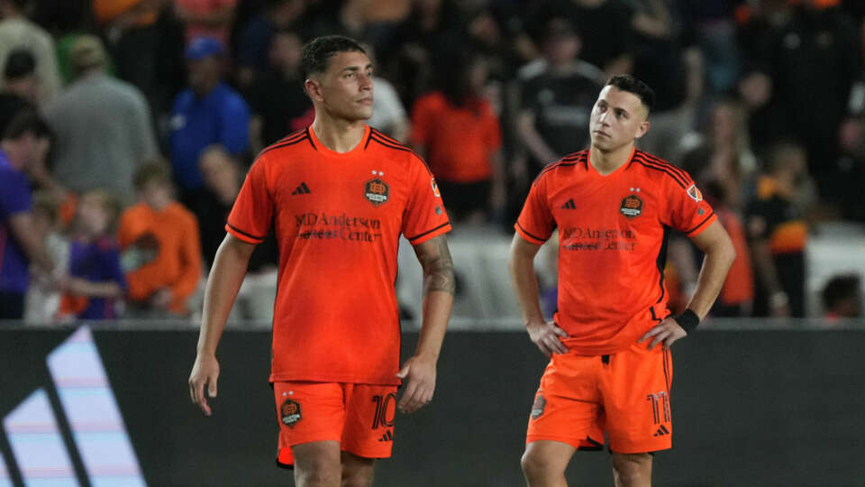 Houston Dynamo forward Sebastián Ferreira, right, reacts alongside forward Ezequiel Ponce after losing to Seattle Sounders FC 7-6 in penalty kicks during Game 2 of a Western Conference MLS Cup playoff series at Shell Energy Stadium, Sunday, Nov. 3, 2024, in Houston.