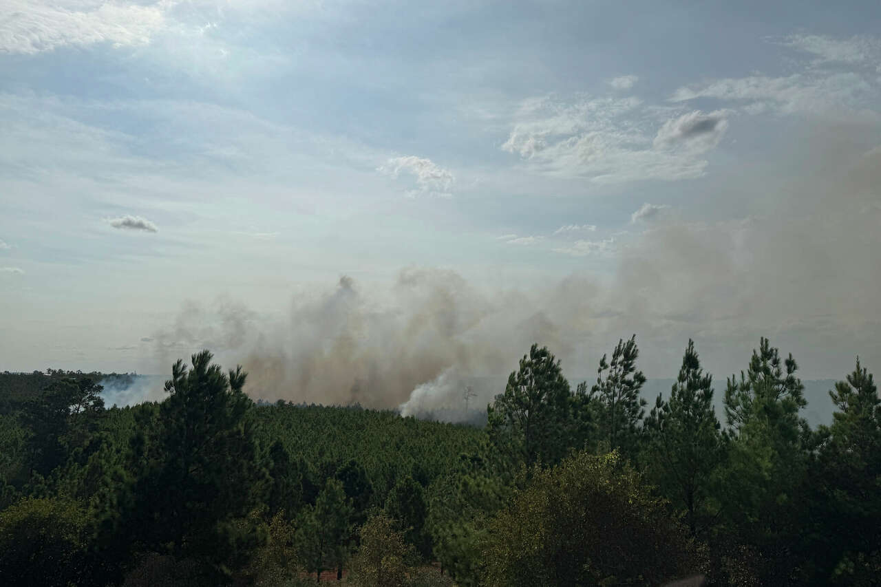 Smoke rises from the Hudson Fire in Bastrop County on Sunday. The 400-acre wildfire was only 20% contained, fire officials said on Monday.