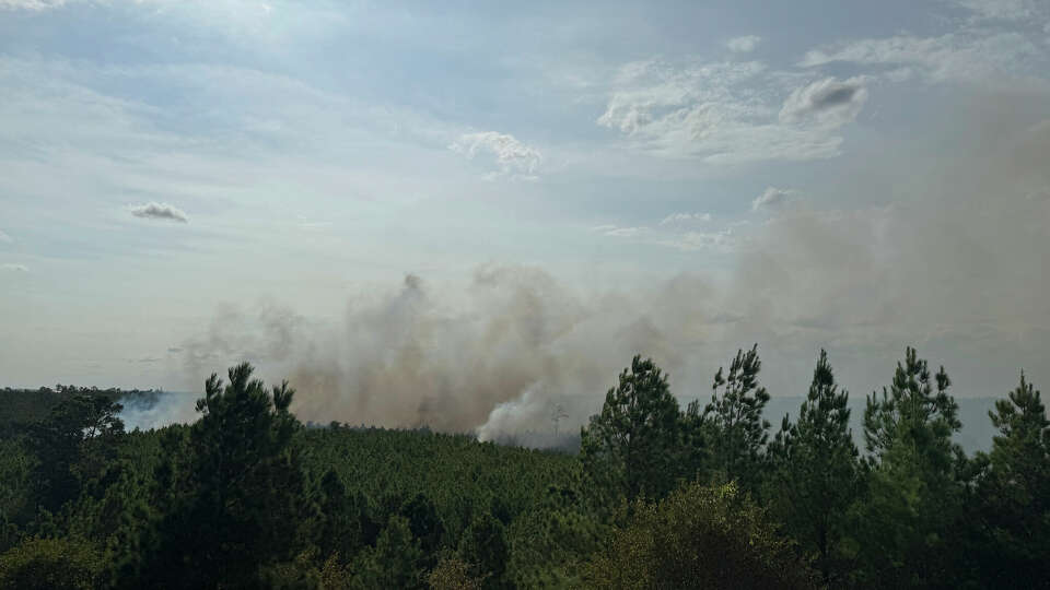 Smoke rises from the Hudson Fire in Bastrop County on Sunday. The 400-acre wildfire was only 20% contained, fire officials said on Monday.