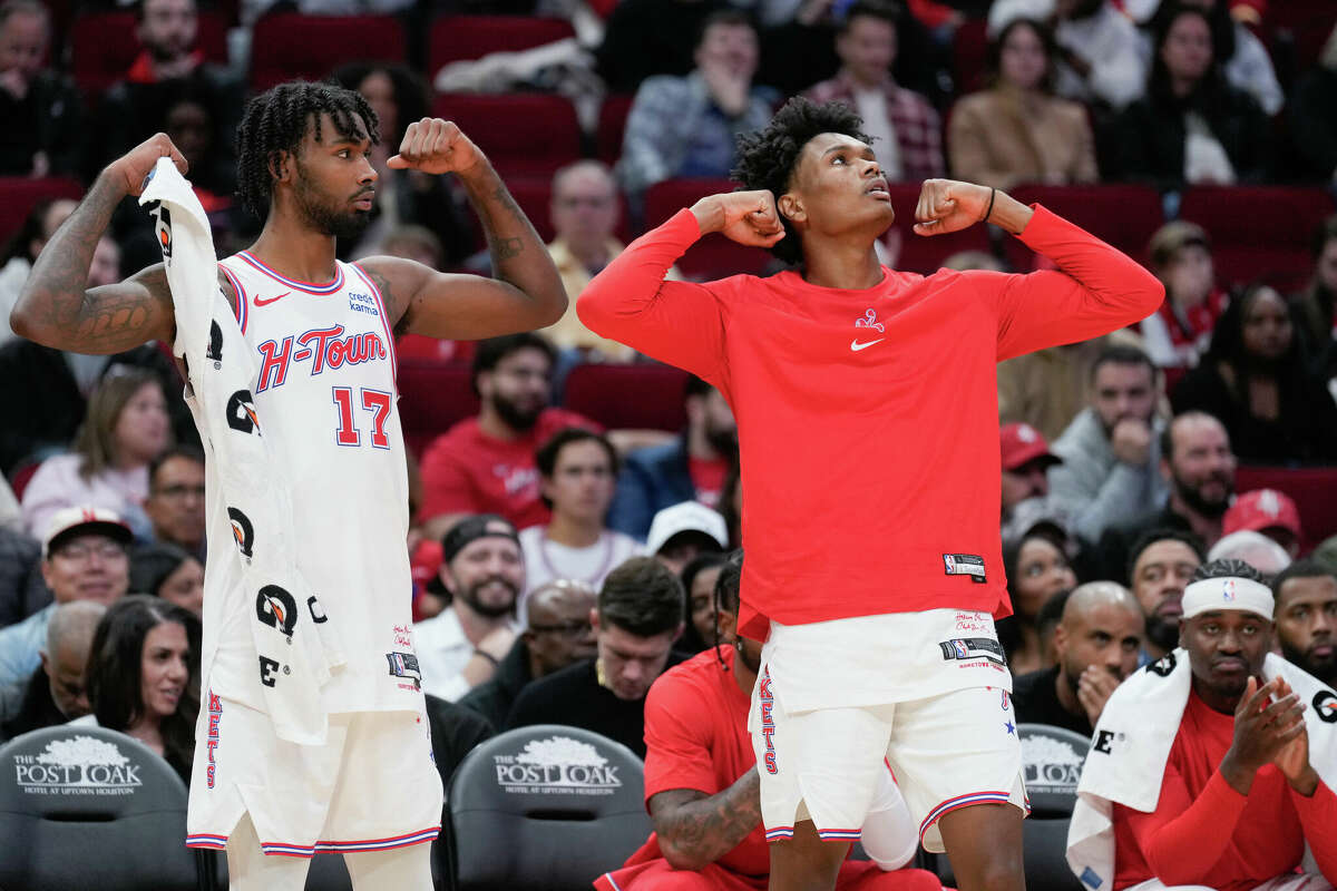 Houston Rockets forward Tari Eason (17) and forward Amen Thompson (1) react after teammate and forward Jeff Green drew a foul during the first half of an NBA basketball game at Toyota Center, Friday, Dec. 29, 2023, in Houston.