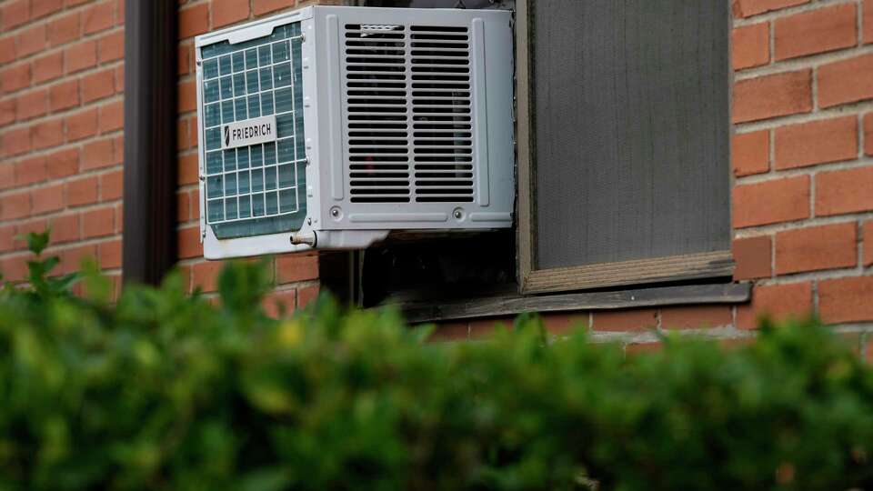 Kelly Courts apartments with window AC unites are photographed Friday, Nov. 1, 2024 at Fifth Ward in Houston. A year and millions of dollars later, some residents say their units have been uninstalled.