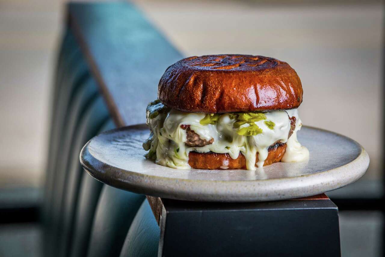 French cheeseburger, stout beef patty, raclette, butter, and pickles at Squable Thursday, Aug. 15, 2019, in Houston.