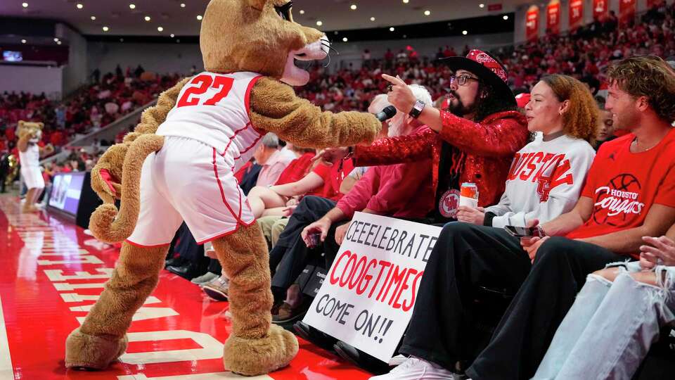 Houston Cougars mascot Sasha interacts with the fans during a time out in the second half of an NCAA college basketball game against Jackson State on Monday, Nov. 4, 2024, in Houston.