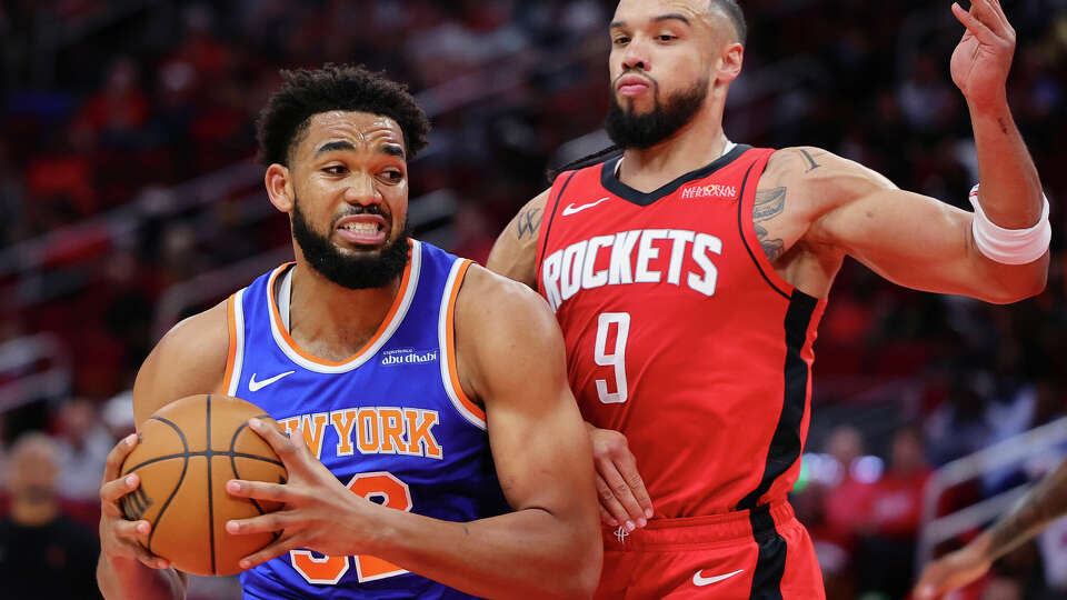 HOUSTON, TEXAS - NOVEMBER 04: Karl-Anthony Towns #32 of the New York Knicks drives against Dillon Brooks #9 of the Houston Rockets during the first half at Toyota Center on November 04, 2024 in Houston, Texas. NOTE TO USER: User expressly acknowledges and agrees that, by downloading and or using this photograph, User is consenting to the terms and conditions of the Getty Images License Agreement. (Photo by Alex Slitz/Getty Images)