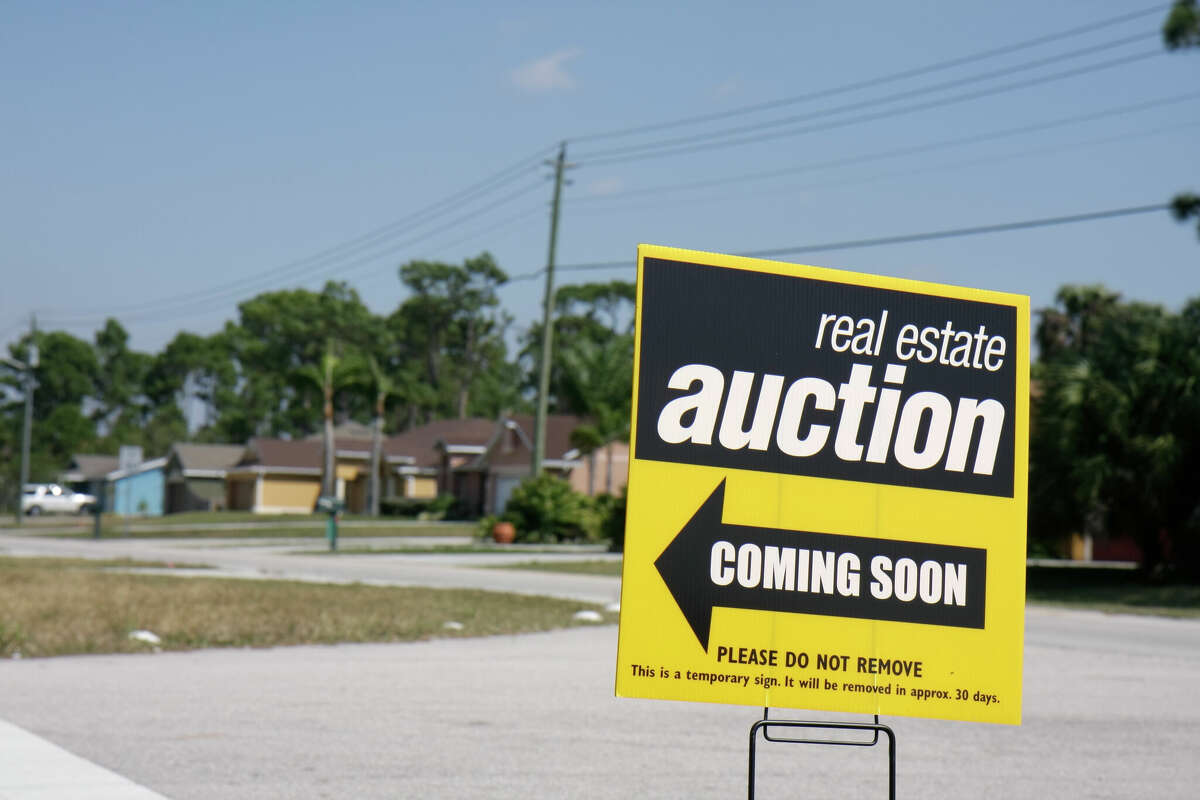 An auction sign for houses at Port Saint Lucie. (Photo by: Jeffrey Greenberg/Universal Images Group via Getty Images)