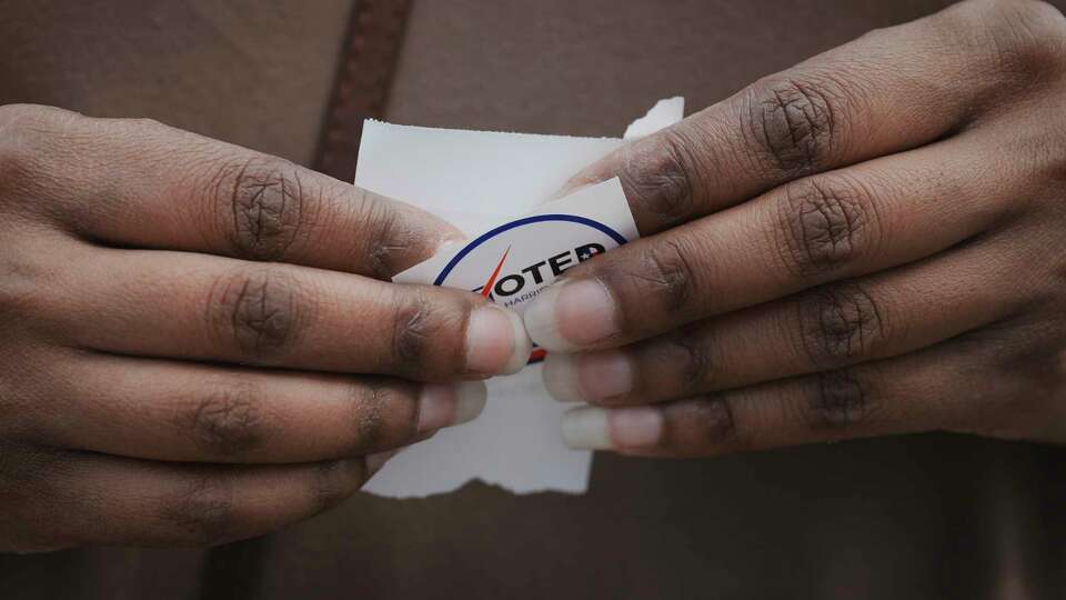 A voter holds a 