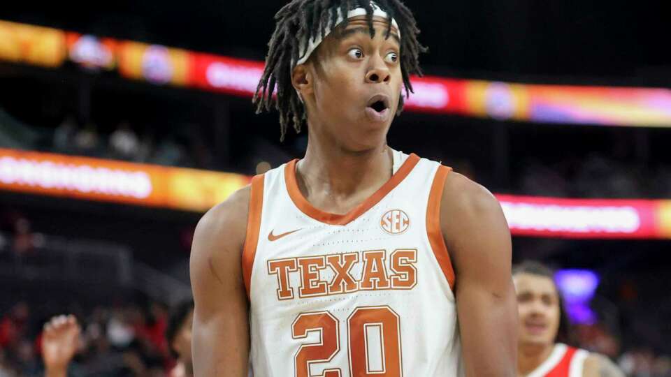 Texas guard Tre Johnson (20) reacts after a foul on Ohio State during the second half of an NCAA basketball game Monday, Nov. 4, 2024, in Las Vegas. (AP Photo/Ian Maule)