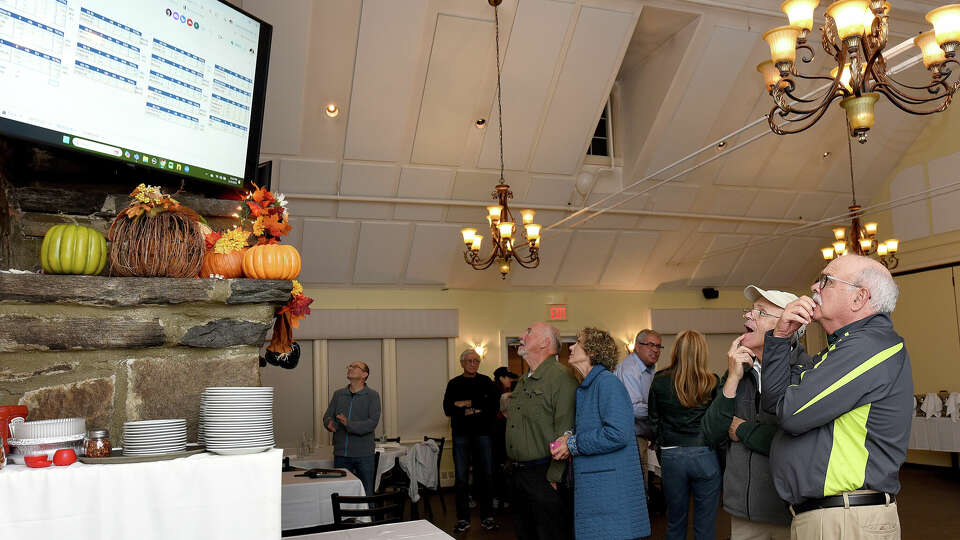 Wayne Fox and his brother Roger watch results come in early election night at the watch party for Democrats at Zody’s 19th Hole in Stamford, Tuesday, Nov. 5, 2024.