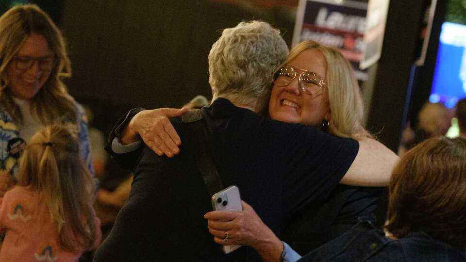 Democratic candidate for Texas state representative of District 121 Laurel Jordan Swift embraces a supporter at her election watch party at Stone Werks in Lincoln Heights on Tuesday, Nov. 5, 2024.