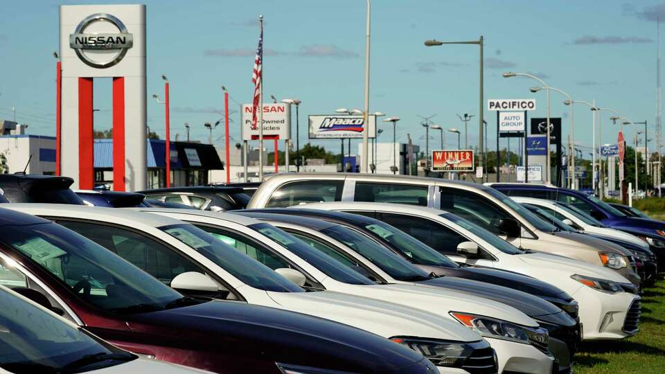 FILE - Cars for sale line the road at a used auto dealership in Philadelphia, Thursday, Sept. 29, 2022. The Federal Reserve’s expected move Wednesday, July 26, 2023, to raise interest rates for the 11th time could once again send ripple effects across the economy. (AP Photo/Matt Rourke, FILE)