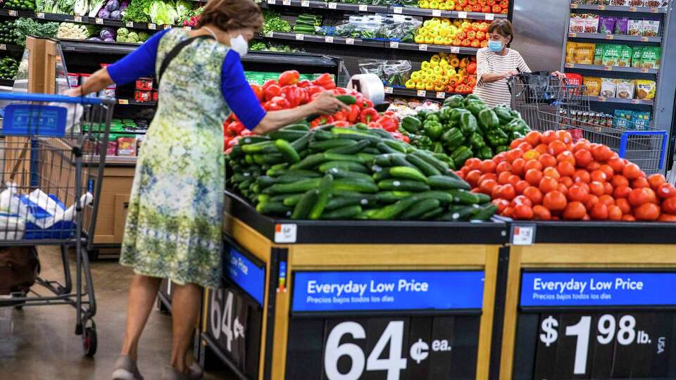 FILE - People buy groceries at a Walmart Superstore in Secaucus, New Jersey, July 11, 2024.