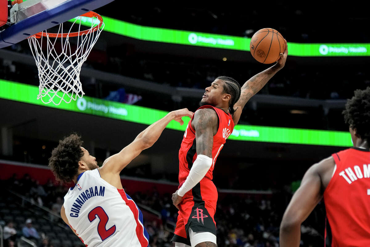 Jalen Green #4 of the Houston Rockets dunks the ball against Cade Cunningham #2 of the Detroit Pistons during the fourth quarter at Little Caesars Arena on November 10, 2024 in Detroit, Michigan. 