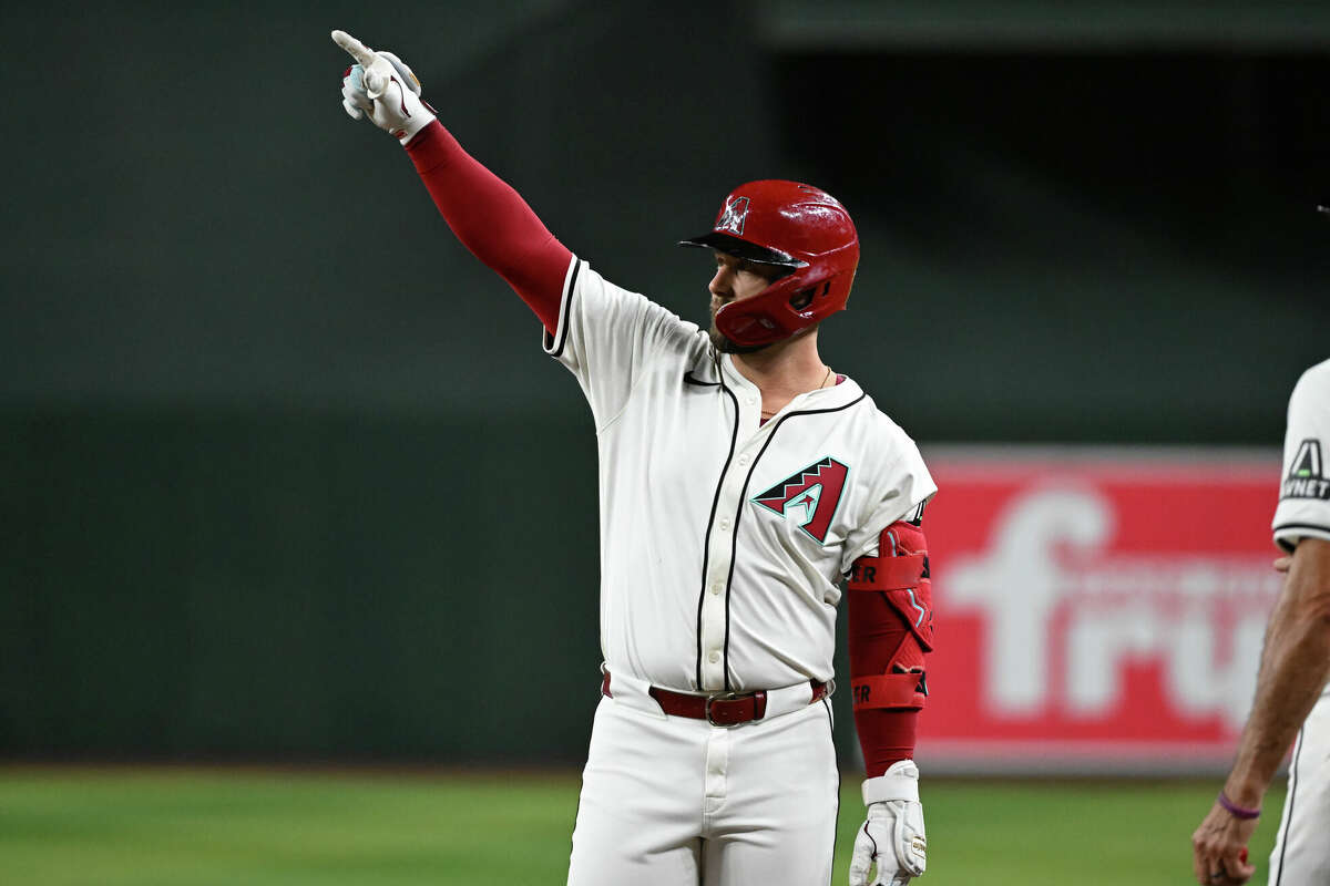 PHOENIX, ARIZONA - SEPTEMBER 25: Christian Walker #53 of the Arizona Diamondbacks gestures to his dugout after hitting an RBI single against the San Francisco Giants during the fourth inning at Chase Field on September 25, 2024 in Phoenix, Arizona. Dbacks won 8-2. (Photo by Norm Hall/Getty Images)