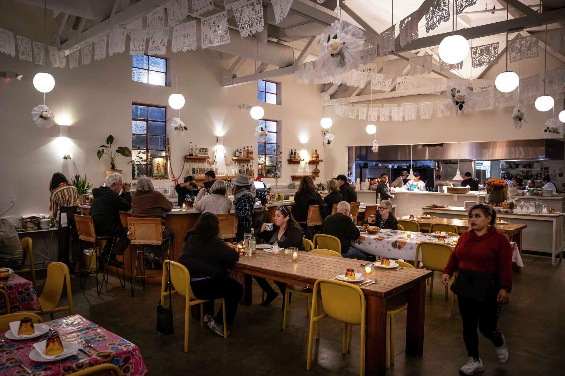 The main dining room at Bombera Restaurant in Oakland, Calif., on November 11, 2024. Bombera postponed a pop-up with Tokyo’s Hogure Onigiri Stand after the gues