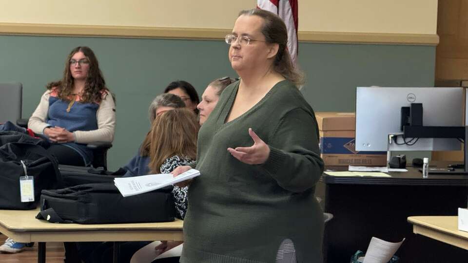 Melissa Russell, the moderator for Tuesday's recount in Torrington City Hall, gave spectators the rules for observing election workers.