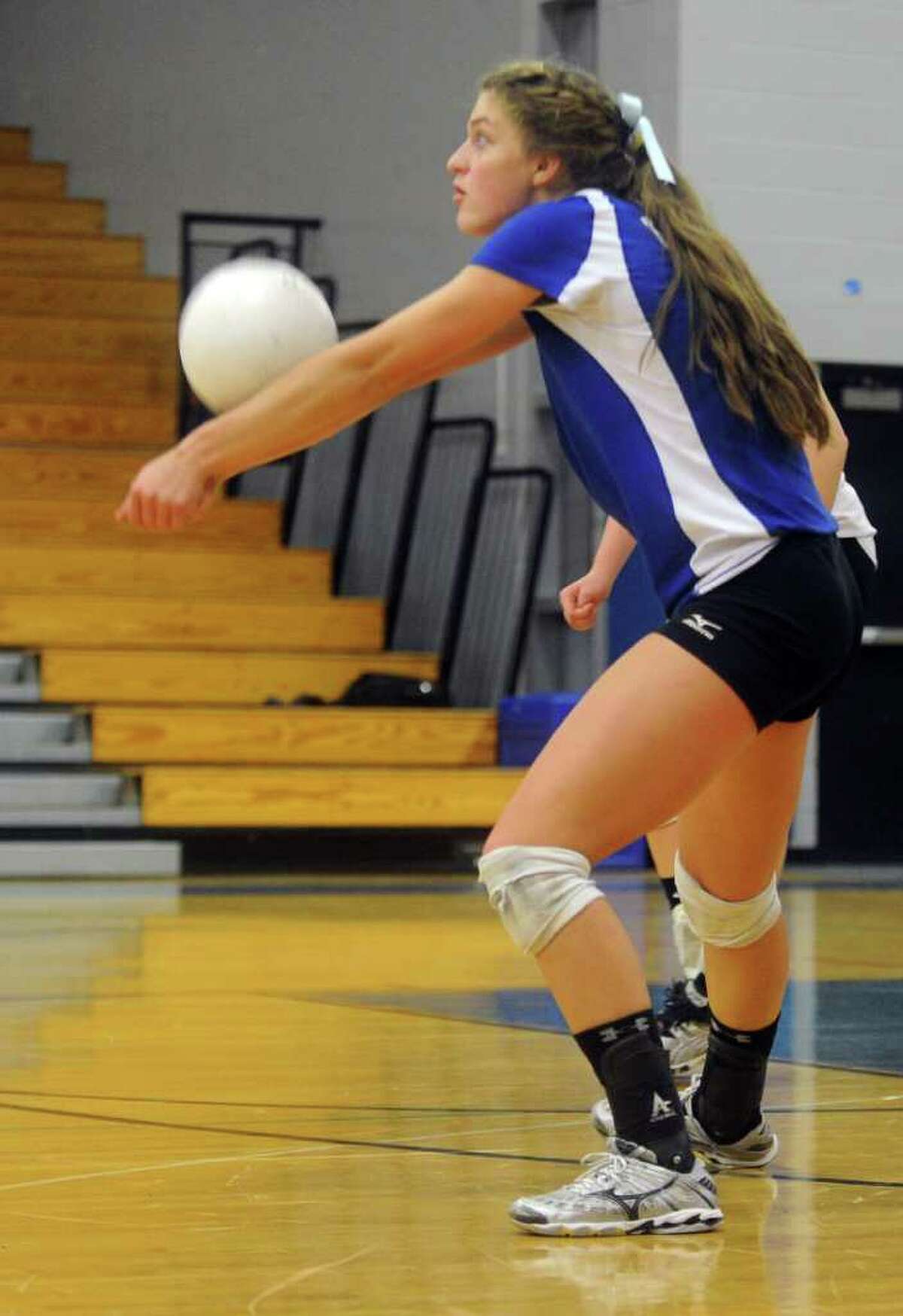 Darien's Emma Getsinger bumps the ball during Thursday's FCIAC volleyball semifinal game against St. Joseph's at Fairfield Ludlowe High School on November 4, 2010.
