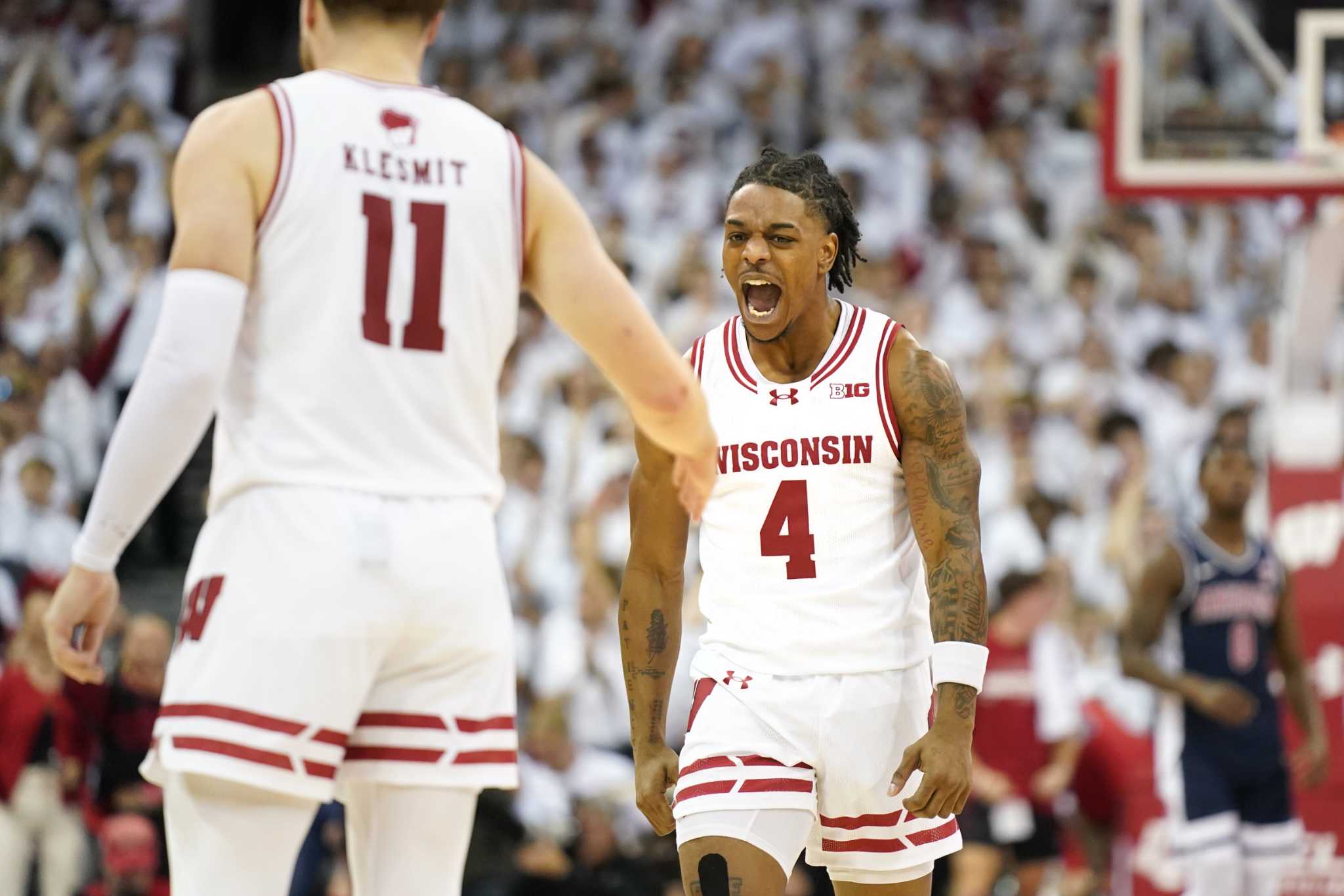 John Tonje scores 41 points as Wisconsin tops No 9 Arizona 103 88 in 