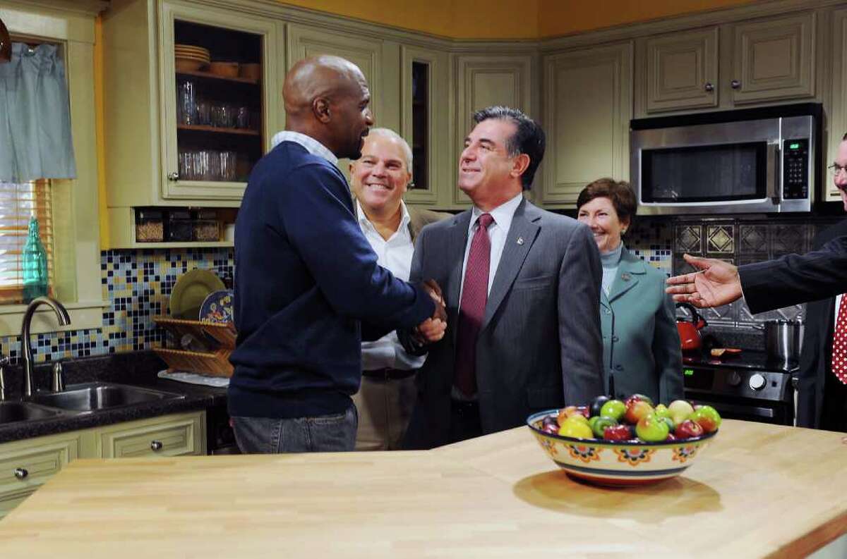 Terry Crews, former NFL player and actor, tours the set of TBS's sitcom 'Are We There Yet' with Stamford Mayor Michael Pavia, Lieutenant Governor Michael Fedele and State Representative Livvy Floren at the CT Film Center Stages in Stamford, Conn. on Friday November 5, 2010. Crewes plays Nick, new husband and stepfather, on the show.